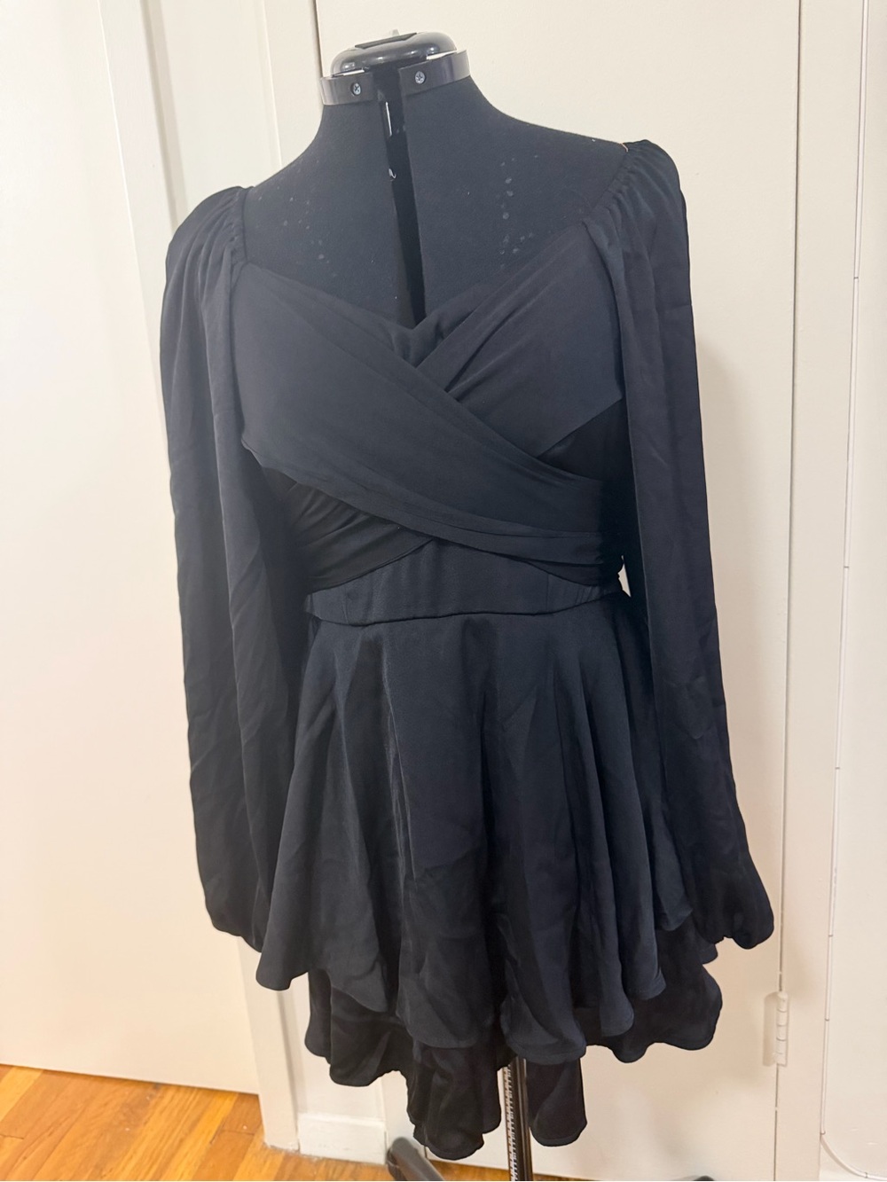 Black Long-Sleeve Wrap-Front Romper with Flared Skirt